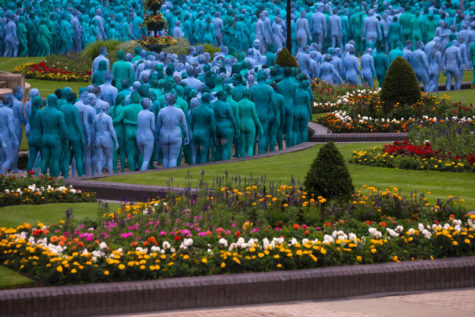Naked volunteers, painted in blue